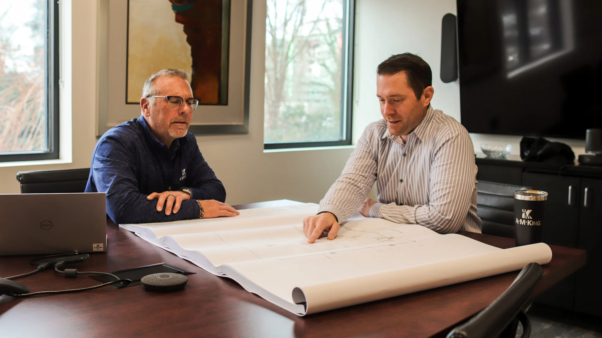Brian McGee, A M King Business Development Manager, talks with Carl Morse, A M King Vice President about food facility design and construction.